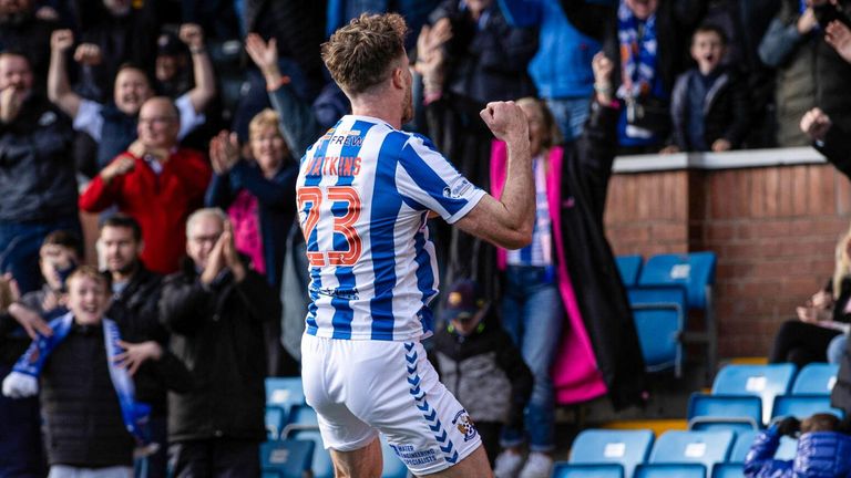 Marley Watkins leaps in celebration after scoring a late goal to put Kilmarnock ahead against Rangers