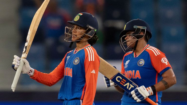 India's Smriti Mandhana, left, celebrates her fifty runs during the ICC Women's T20 World Cup 2024 match between India and Sri Lanka at Dubai International Stadium, United Arab Emirates, Wednesday, Oct. 9, 2024. (AP Photo/Altaf Qadri)