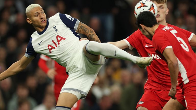 Tottenham's Richarlison, left, challenges for the ball with AZ Alkmaar's Alexandre Penetra, right, and Maxim Dekker during the Europa League opening phase soccer match between Tottenham and AZ Alkmaar at the Tottenham Hotspur Stadium in London, Thursday, Oct. 24, 2024. (AP Photo/Ian Walton)