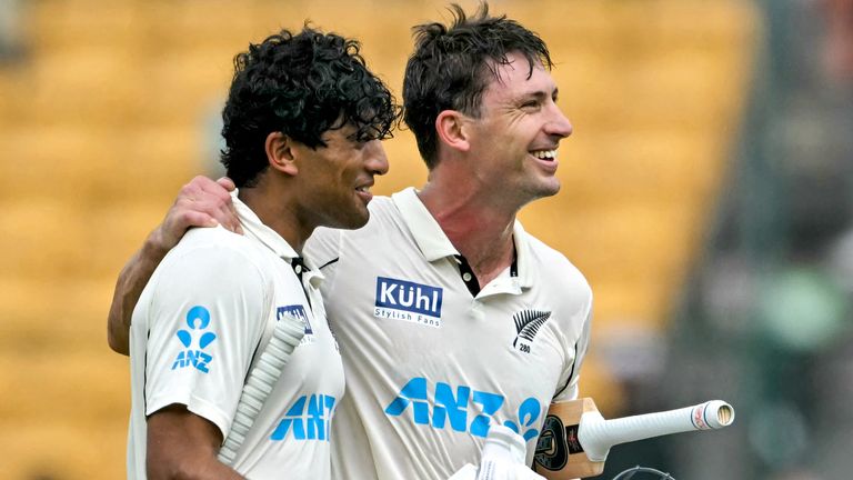 New Zealand's Will Young (R) and Rachin Ravindra celebrate their team's win over India in the first Test (Getty Images)