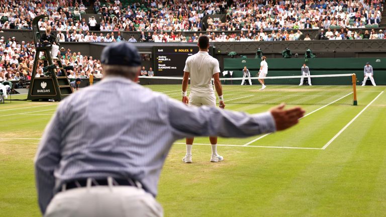 A line judge calls out during the Men's Singles quarter final between Novak Djokovic and Andrey Rublev