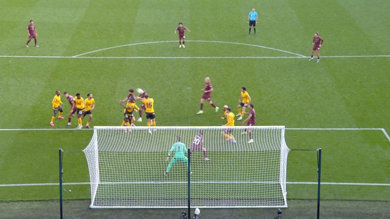 Bernardo Silva moves away from Jose Sa before John Stones' header