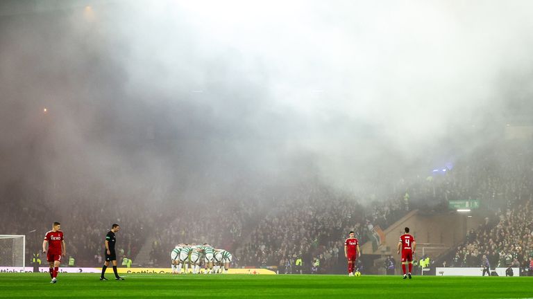 Kick-off was delayed as smoke rose around Hampden