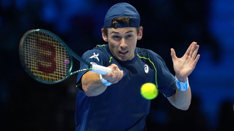 Australia's Alex de Minaur returns the ball to Italy's Jannik Sinner during their singles tennis match of the ATP World Tour Finals at the Inalpi Arena, in Turin, Italy, Sunday, Nov. 10, 2024. (AP Photo/Antonio Calanni)