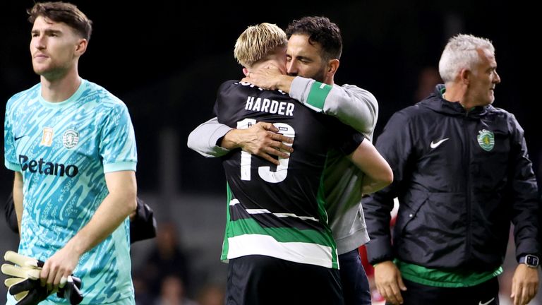 Sporting's head coach Ruben Amorim embraces Sporting's Conrad Harder at the end of the Portuguese league soccer match between SC Braga and Sporting CP at the Municipal stadium in Braga, Portugal, Sunday, Nov. 10, 2024. Harder scored twice in Sporting's 4-2 win. (AP Photo/Luis Vieira)