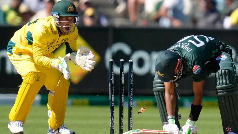 Pakistan's Babar Azam, right, is bowled as Australia's Josh Inglis watches during their one day international cricket match in Melbourne, Monday, Nov. 4, 2024. (AP Photo/Asanka Brendon Ratnayake)