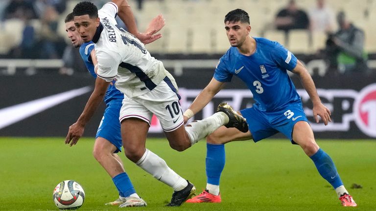 England's Jude Bellingham, center, controls the ball during the UEFA Nations League Group F soccer match between Greece and England at Olympic Stadium in Athens, Thursday, Nov. 14, 2024. (AP Photo/Petros Giannakouris)