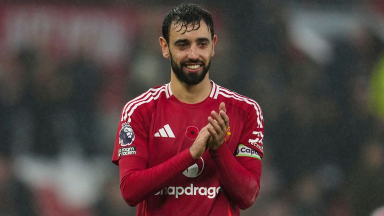 Manchester United's Bruno Fernandes celebrates at the end of the English Premier League soccer match between Manchester United and Leicester City, at the Old Trafford stadium in Manchester, England, Sunday, Nov.10, 2024. (AP Photo/Jon Super)