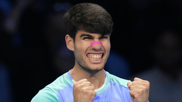 Spain's Carlos Alcaraz celebrates after winning the singles tennis match of the ATP World Tour Finals against Russia's Andrey Rublev, at the Inalpi Arena, in Turin, Italy, Wednesday, Nov. 13, 2024. (AP Photo/Antonio Calanni)