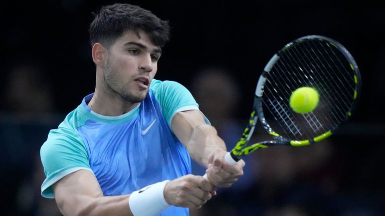 Spain's Carlos Alcaraz backhands to France's Ugo Humbert during their third round match of the Paris Masters tennis tournament at the Accor Arena, Thursday, Oct. 31, 2024 in Paris. (AP Photo/Michel Euler)