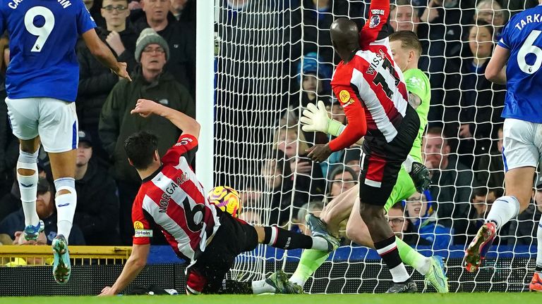 Brentford's Christian Norgaard fouls Everton goalkeeper Jordan Pickford