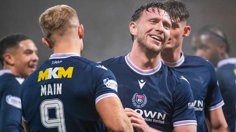 DUNDEE, SCOTLAND - NOVEMBER 23: Dundee's Curtis Main celebrates with Jordan McGhee after scoring to make it 4-1 during a William Hill Premiership match between Dundee and Hibernian at the Scot Foam Stadium at Den's Park on November 23, 2024, in Dundee, Scotland. (Photo by Euan Cherry / SNS Group)