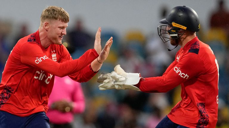 England's Dan Mousley, left, celebrates wicket keeper Phil Salt taking the wicket of West Indies' captain Rovman Powell during the second T20 cricket match at Kensington Oval in Bridgetown, Barbados, Sunday, Nov. 10, 2024. (AP Photo/Ricardo Mazalan)