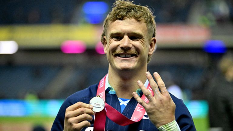 Scotland's wing Darcy Graham celebrates with his man of the match medal after scoring four tries against Fiji