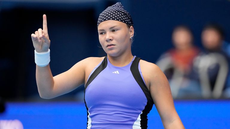 Russia's Diana Shnaider reacts as she plays against China's Zheng Qinwen during the second semifinal match of the Pan Pacific Open women's tennis tournament at Ariake Coliseum, in Tokyo, Saturday, Oct. 26, 2024. (AP Photo/Eugene Hoshiko)