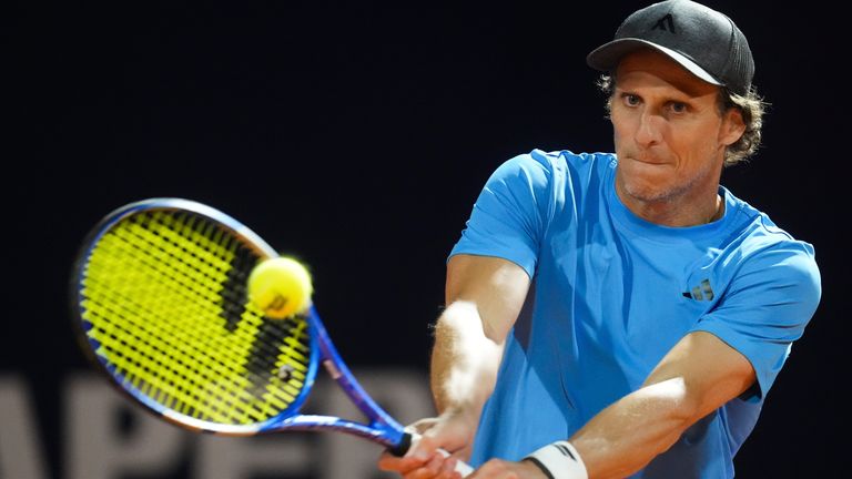 Uruguay's Diego Forlan returns the ball to Boris Arias and Federico Zeballos during a men's doubles tennis match at the 2024 Uruguay Open in Montevideo, Uruguay, Wednesday, Nov. 13, 2024. (AP Photo/Matilde Campodonico)