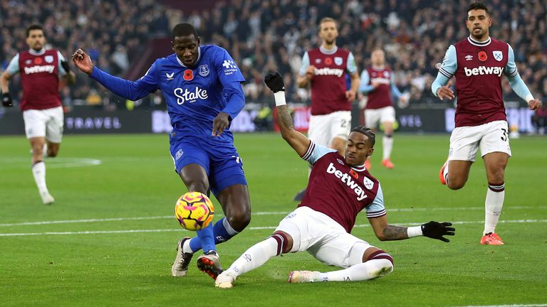 Crysencio Summerville blocks Abdoulaye Doucoure's shot