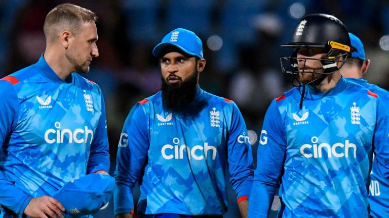 England's captain Liam Livingstone (L), alongside Adil Rashid (C) and Phil Salt (R) after their defeat to the West Indies in the opening ODI in Antigua