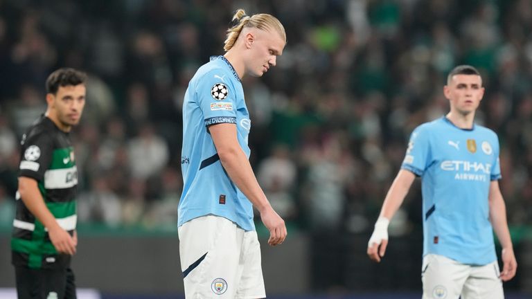 Manchester City's Erling Haaland reacts after missing a penalty kick during the UEFA Champions League opening phase match between Sporting and Manchester City in Lisbon, Portugal, Tuesday, Nov. 5, 2024. (AP Photo/Armando Franca)