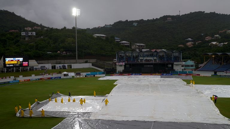 Ground staff move the covers as rain delays the fifth T20 cricket match between West Indies and England at Daren Sammy National Cricket Stadium in Gros Islet, St. Lucia, Sunday, Nov. 17, 2024. (AP Photo/Ricardo Mazalan)