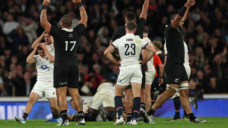 England's George Ford (C) reacts after missing a last second drop-goal handing the win to New Zealand in the Autumn Nations Series International rugby union test match between England and New Zealand at the Allianz Stadium, Twickenham in south-west London, on November 2, 2024. New Zealand won the game 24-22. (Photo by Adrian Dennis / AFP)