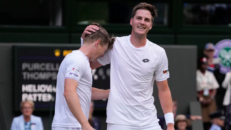 Harri Heliovaara, left, of Finland and Henry Patten of Britain celebrate after defeating Australia's Max Purcell and compatriot Jordan Thompson in the men's doubles final at the Wimbledon tennis championships in London, Saturday, July 13, 2024.(AP Photo/Alberto Pezzali)