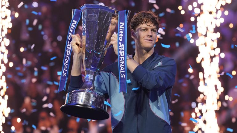 Italy's Jannik Sinner holds the trophy after winning the final match of the ATP World Tour Finals against Taylor Fritz of the United States at the Inalpi Arena, in Turin, Italy, Sunday, Nov. 17, 2024. (AP Photo/Antonio Calanni)