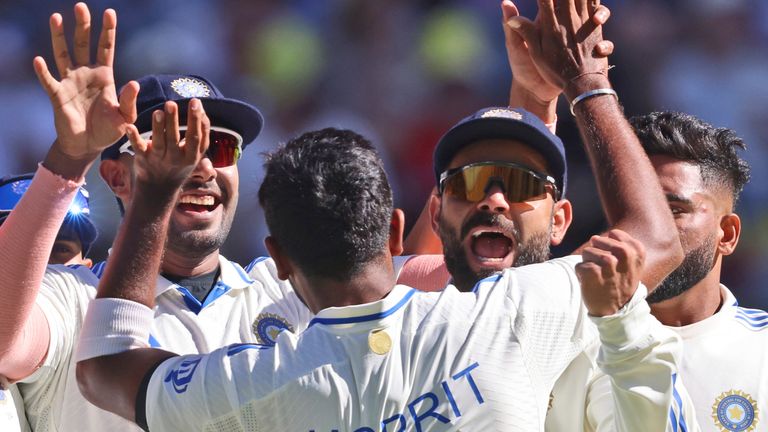 India's captain Jasprit Bumrah, back to the camera celebrates with teammates the wicket of Australia's Nathan McSweeney on the first day of the first cricket test between Australia and India in Perth, Australia, Friday, Nov. 22, 2024. (AP Photo/Trevor Collens) 