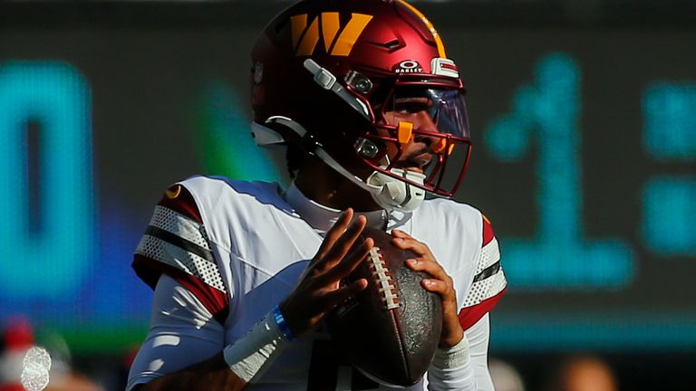 Washington Commanders quarterback Jayden Daniels (5) looks to pass against the New York Giants during the second quarter of an NFL football game, Sunday, Nov. 3, 2024, in East Rutherford, N.J. (AP Photo/John Munson)