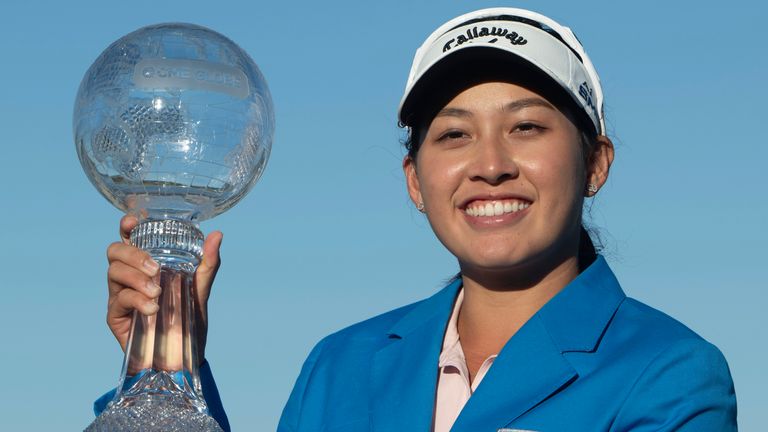 Jeeno Thitikul poses on the 18th green with the LPGA CME Group Tour Championship golf tournament trophy Sunday, Nov. 24, 2024, in Naples, Fla. (AP Photo/Chris Tilley)