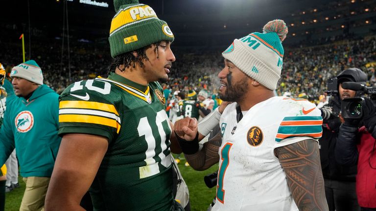 Green Bay Packers quarterback Jordan Love (10) with Miami Dolphins quarterback Tua Tagovailoa (1) after their victory