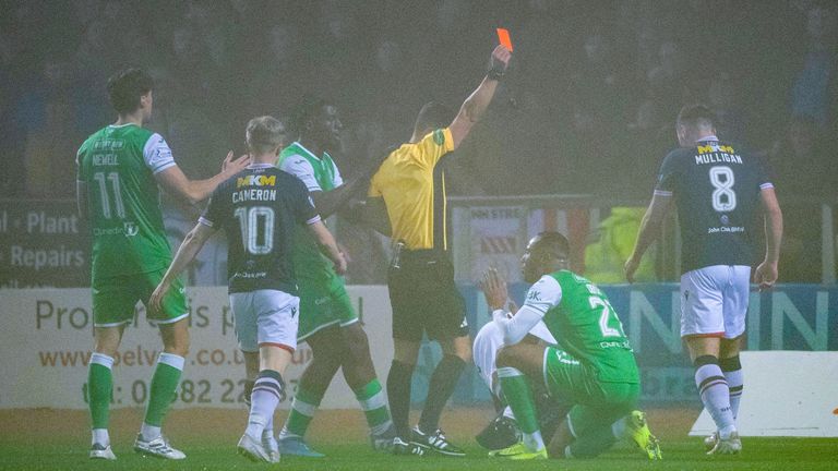 DUNDEE, SCOTLAND - NOVEMBER 23: Hibernian's Jordan Obita is shown a red card during a William Hill Premiership match between Dundee and Hibernian at the Scot Foam Stadium at Den's Park on November 23, 2024, in Dundee, Scotland. (Photo by Euan Cherry / SNS Group)