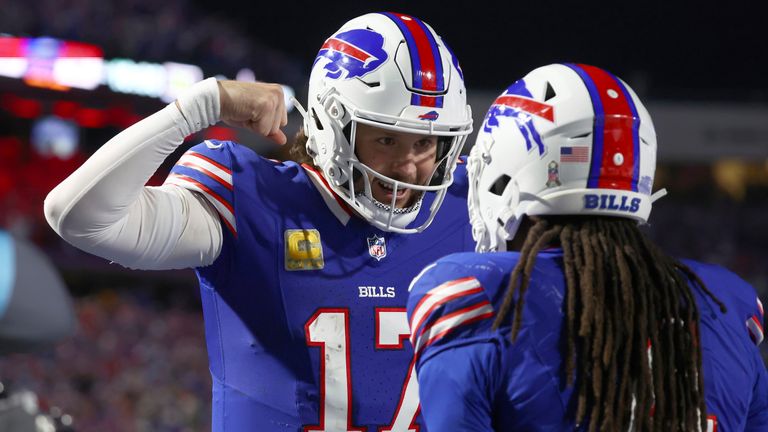 Buffalo Bills quarterback Josh Allen (17) is congratulates teammate James Cook, right, on his touchdown during the first half of an NFL football game against the Kansas City Chiefs Sunday, Nov. 17, 2024, in Orchard Park, N.Y. (AP Photo/Jeffrey T. Barnes)