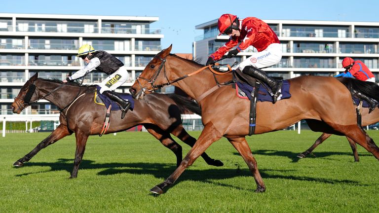 Kalif Du Berlais ridden by Harry Cobden (right) on their way to winning the Coral Racing Club Novices' Limited Handicap Chase