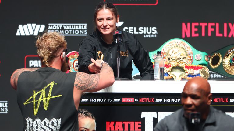 Jake Paul and Katie Taylor make a bet on the outcome of Pauls fight at the final press conference for his upcoming heavyweight fight against Jake Paul at Toyota Music Factory on November 13, 2024 in Irving, Texas. 