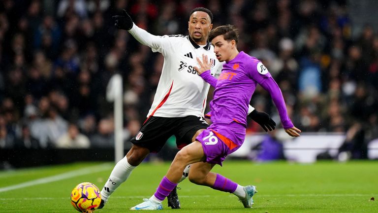 Fulham's Kenny Tete (left) and Wolves' Rodrigo Gomes battle for the ball 