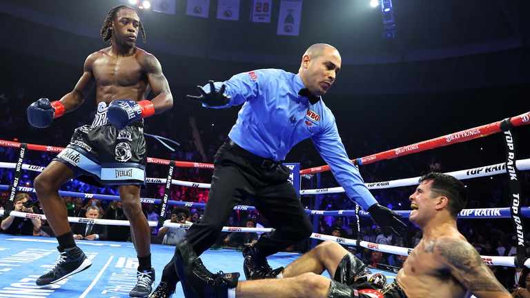 Keyshawn Davis knocks down Gustavo Lemos (credit: Mikey Williams/Top Rank)