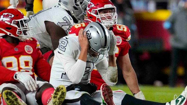 Kansas City Chiefs linebacker Nick Bolton (32) holds the recovery ball after a fumble by the Las Vegas Raiders during the second half of an NFL football game in Kansas City, Mo., Friday, Nov. 29, 2024. (AP Photo/Ed Zurga)