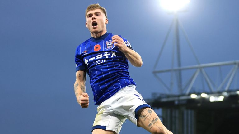 Leif Davis leaps in celebration after giving Ipswich the lead against Leicester