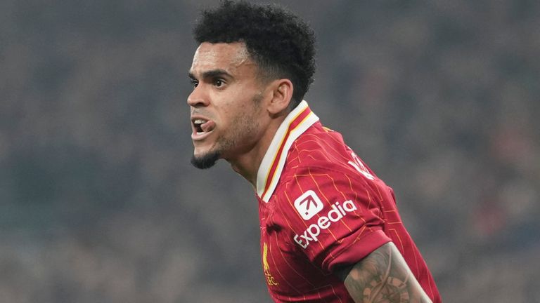 Liverpool's Luis Diaz celebrates after scoring his side's opening goal during the Champions League opening phase soccer match between Liverpool and Bayer Leverkusen