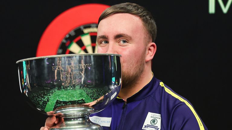 Luke Littler with the Eric Bristow Trophy 