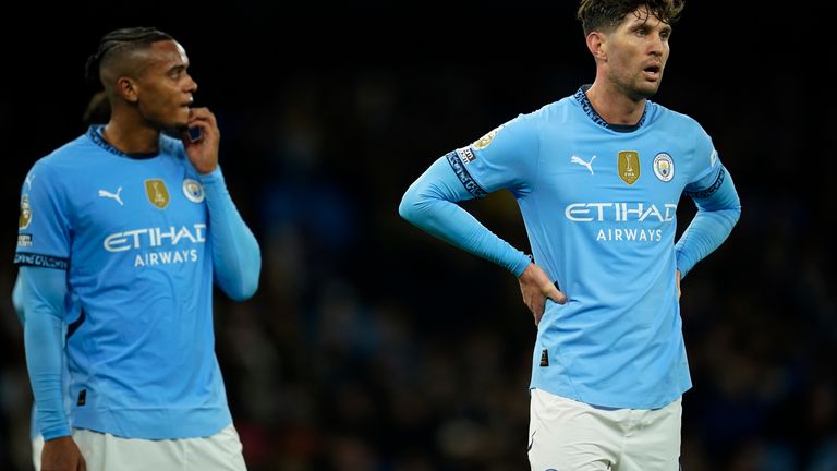 Manchester City's Manuel Akanji and John Stones react during the heavy defeat to Tottenham (AP Photo/Dave Thompson)