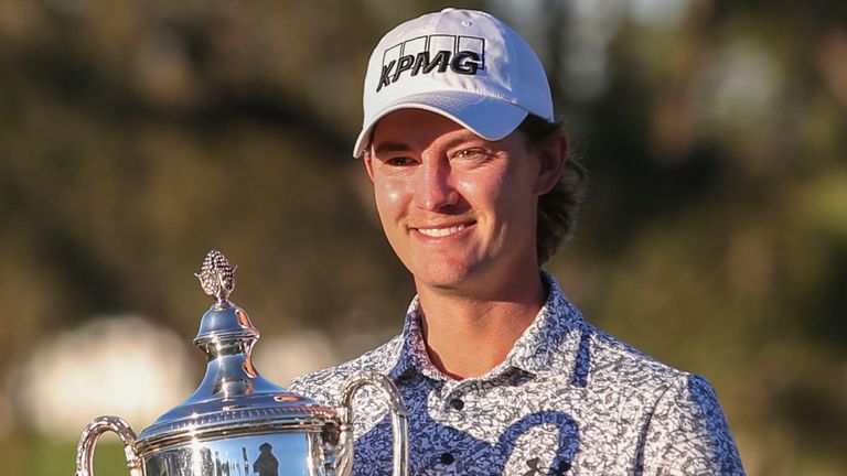 Maverick McNealy holds the trophy after winning the RSM Classic