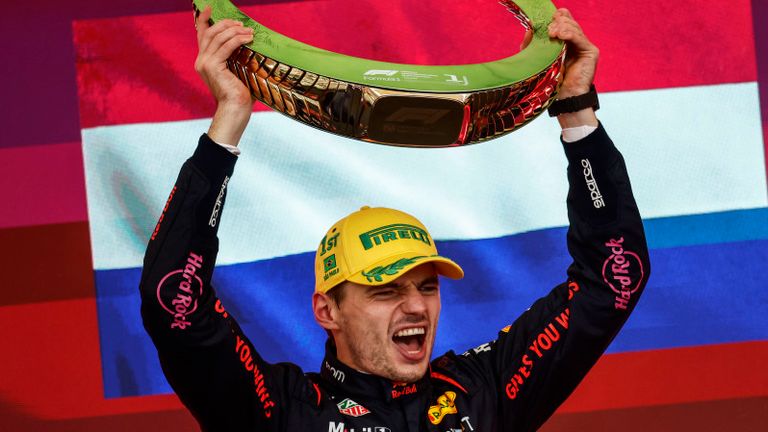 AUT..DROMO JOS.. CARLOS PACE, BRAZIL - NOVEMBER 03: Max Verstappen, Red Bull Racing, 1st position, lifts the winners trophy during the Brazilian GP at Aut..dromo Jos.. Carlos Pace on Sunday November 03, 2024 in Sao Paulo, Brazil. (Photo by Zak Mauger / LAT Images)