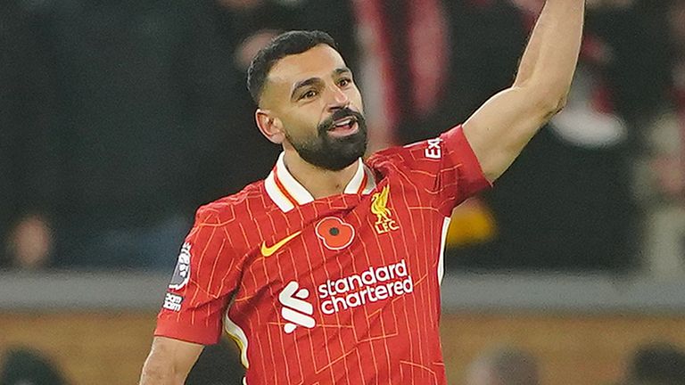 Mohamed Salah celebrates after giving Liverpool a 2-0 lead against Aston Villa at Anfield