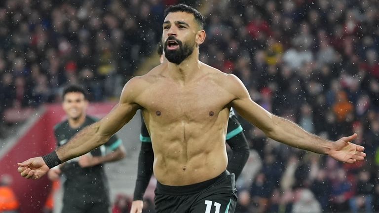 Liverpool's Mohamed Salah celebrates after scoring their third (AP Photo/Sean Ryan)