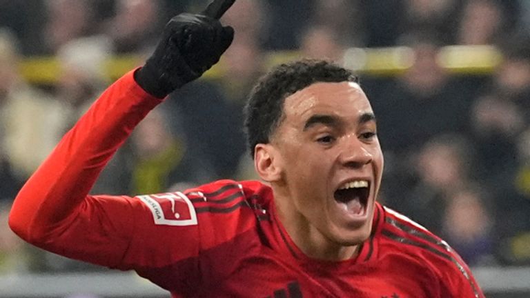 Bayern's Jamal Musiala celebrates after scoring during the German Bundesliga soccer match between Borussia Dortmund and Bayern Munich at the Signal-Iduna Park in Dortmund, Germany, Saturday, Nov. 30, 2024. (AP Photo/Martin Meissner)