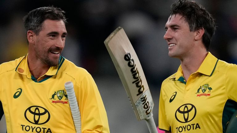 Australia's not-out batters Pat Cummins, right, and Mitchell Starc walk off the ground after their win over Pakistan during their one day international cricket match in Melbourne, Monday, Nov. 4, 2024. (AP Photo/Asanka Brendon Ratnayake) 