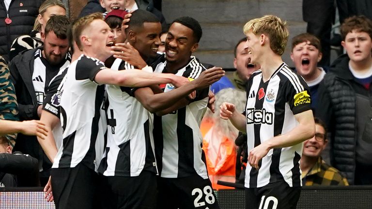 Alexander Isak celebrates with his team-mates after giving Newcastle a first-half lead against Arsenal