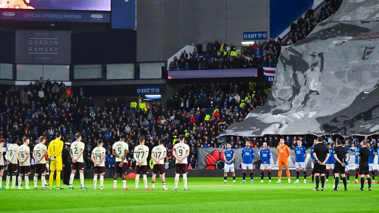 The teams observe a minutes silence ahead of kick off for Remembrance Sunday